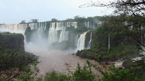 touristic boat on dirty river close to famous iguazu falls in brazil