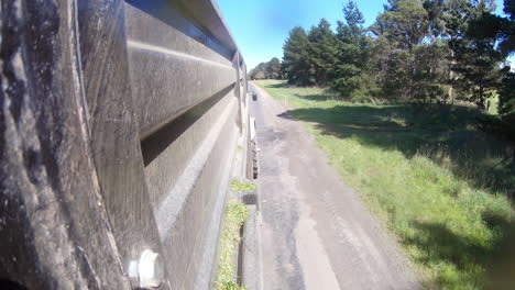 perspective view from side of truck trailer travelling along roadway