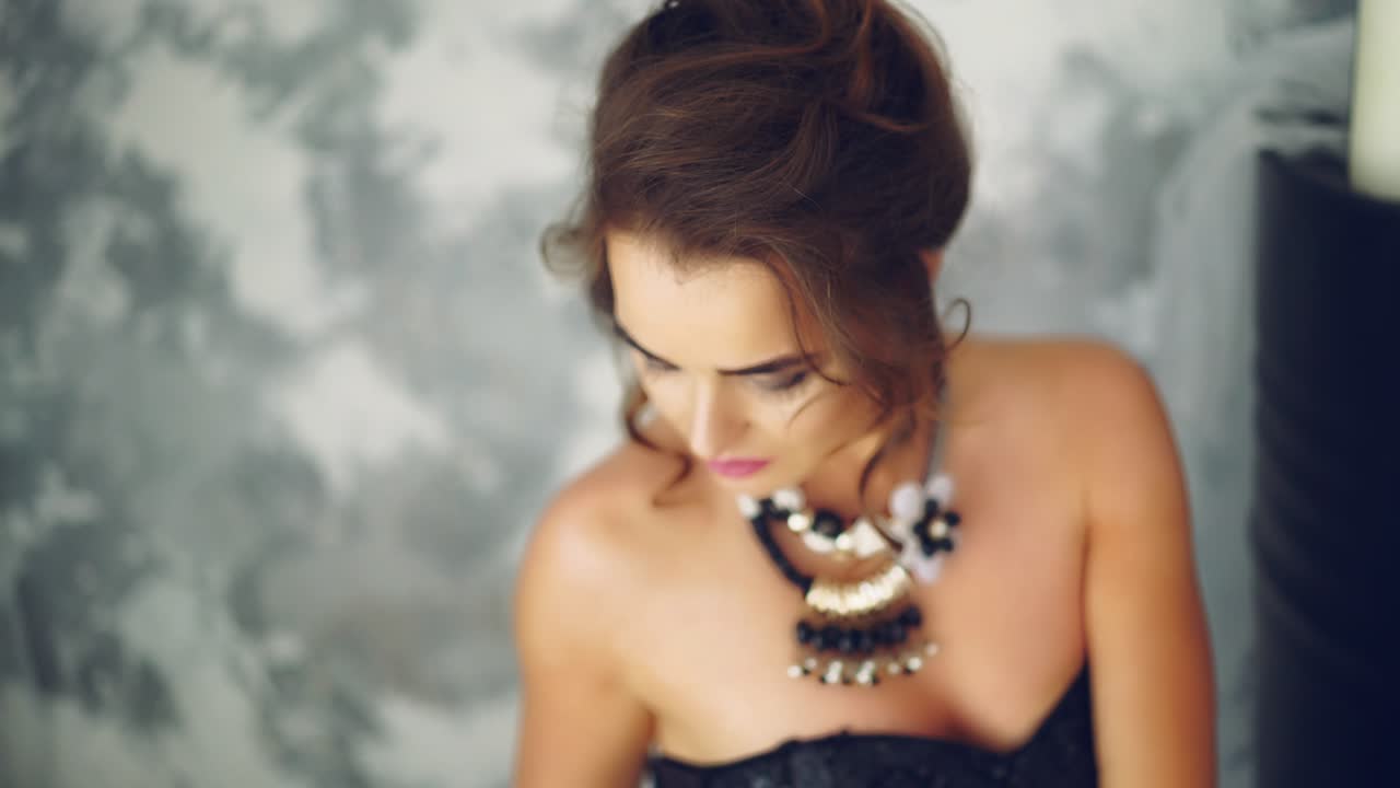 Woman wearing in shiny dress. Stunning woman wearing beautiful shiny dress