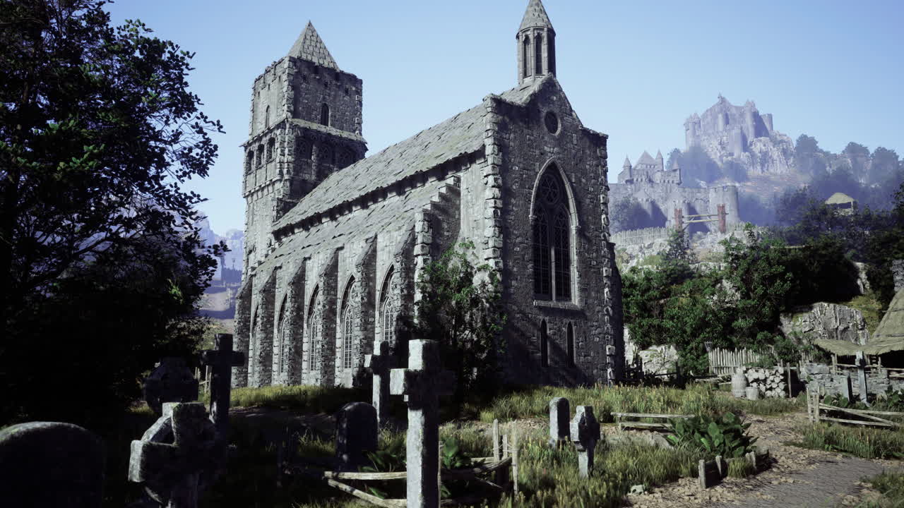 Old stone church surrounded by graveyard under clear sky in rural area