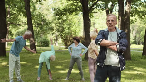senior citizens exercising in park