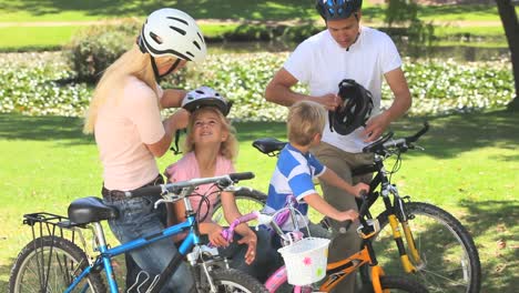 family preparing to go cycling