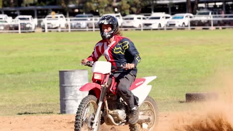 motorcyclist navigating a dirt track course