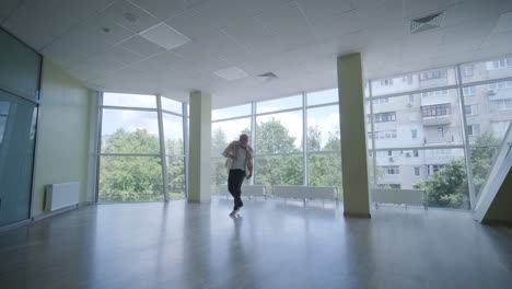 man breakdancing in modern studio