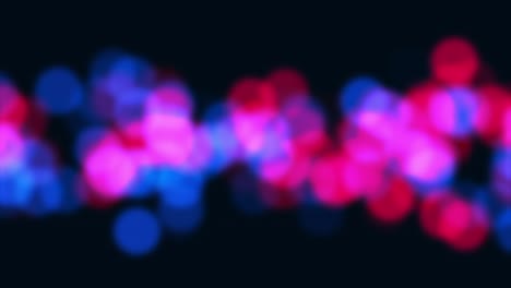 bokeh rojo azul borroso sobre fondo negro