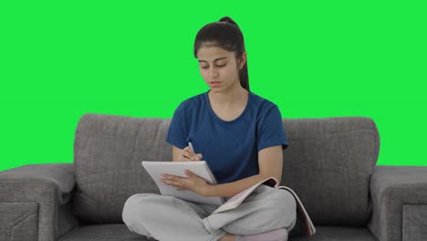 Indian-teenage-girl-preparing-for-exams-Green-screen