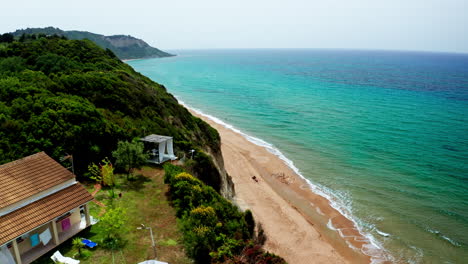 Aerial-drone-shot-over-the-long-stretching-empty-sandy-beach-in-Corfu-in-Greece