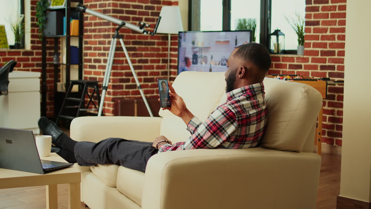 Man on video call at home
