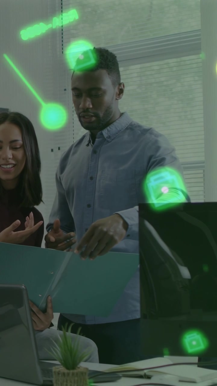 Vertical video: Woman gesturing standing man reviewing teal folder for business green masking faces