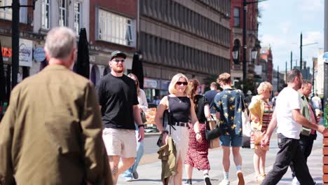 people walking and interacting on a sunny day