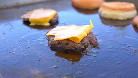 burger and cheese on grill