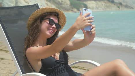 woman taking a selfie on the beach