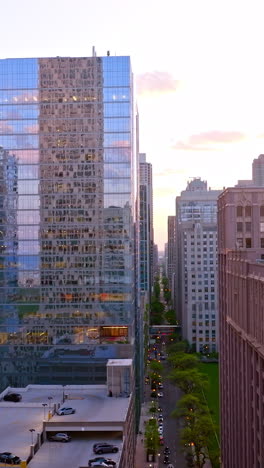 drone raising high above the long street in chicago. beautiful architecture in the amazing metropolis. vertical video