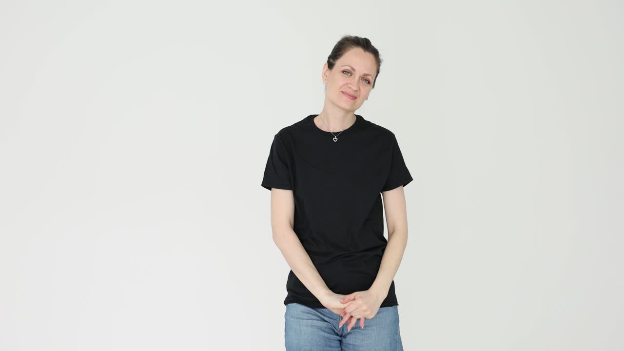 A woman in a black t-shirt and denim jeans