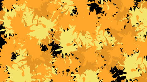 animación de salpicaduras amarillas y naranjas de pintura sobre fondo negro
