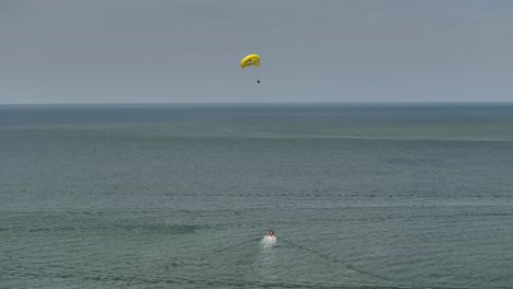 Happy Face parasailing over the Gulf of Mexico in Ft Myers Beach Florida