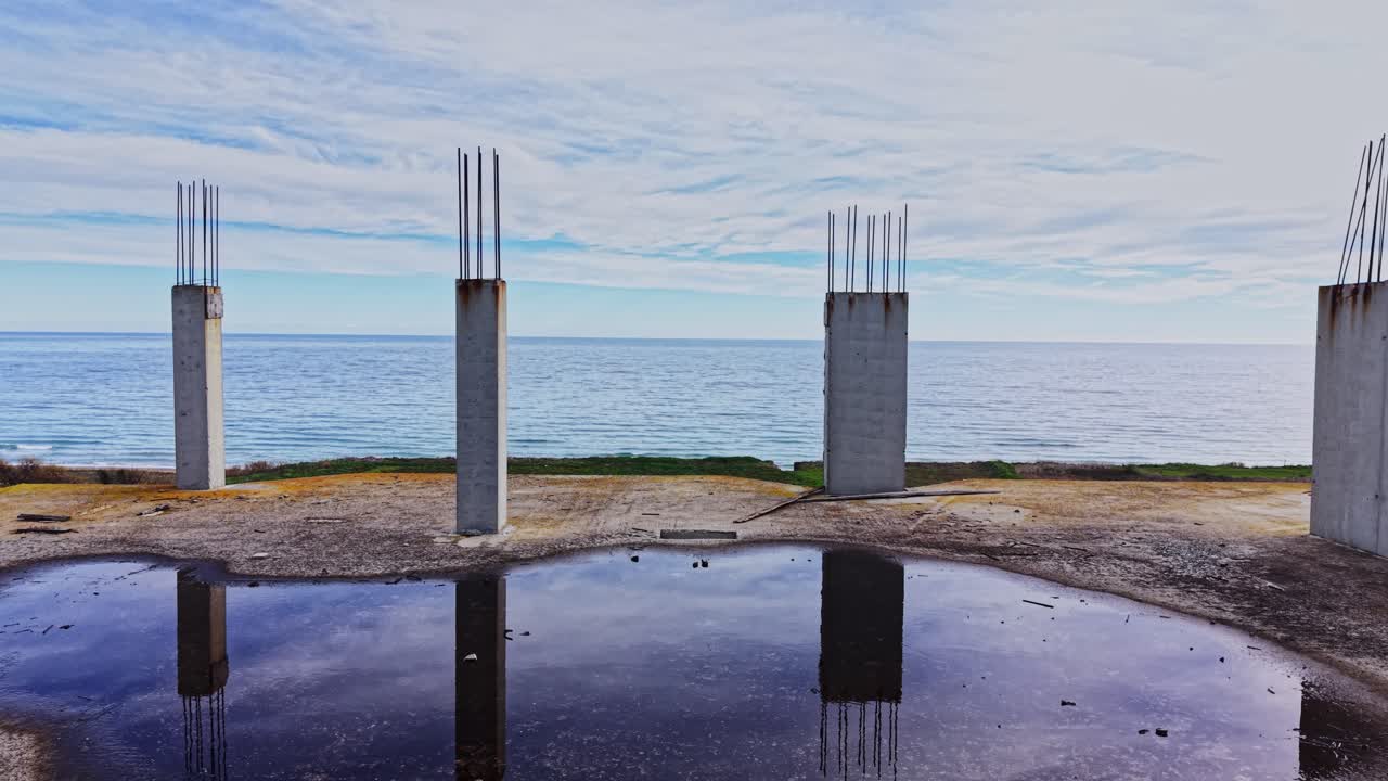Aerial view of abandoned construction site by the ocean