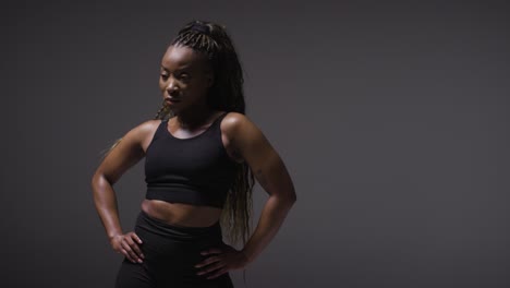 studio portrait of young woman wearing gym fitness clothing for exercise 4