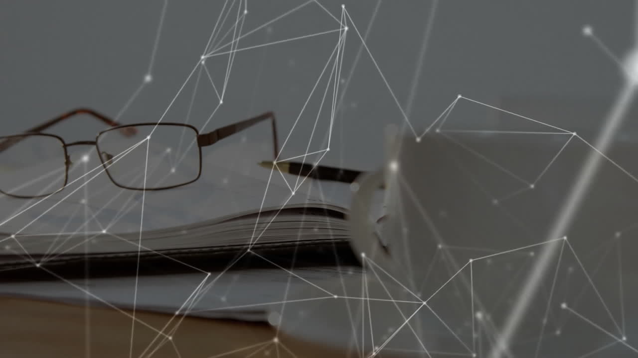 Reading glasses resting on open notebook showcasing glowing network nodes overlaying wooden desk
