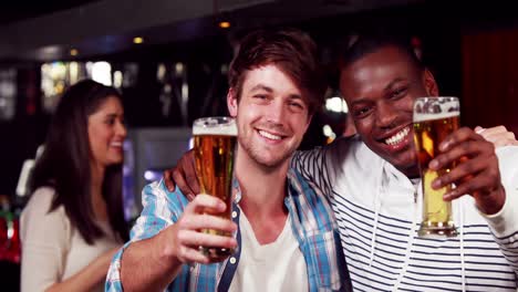 happy friends toasting with beer