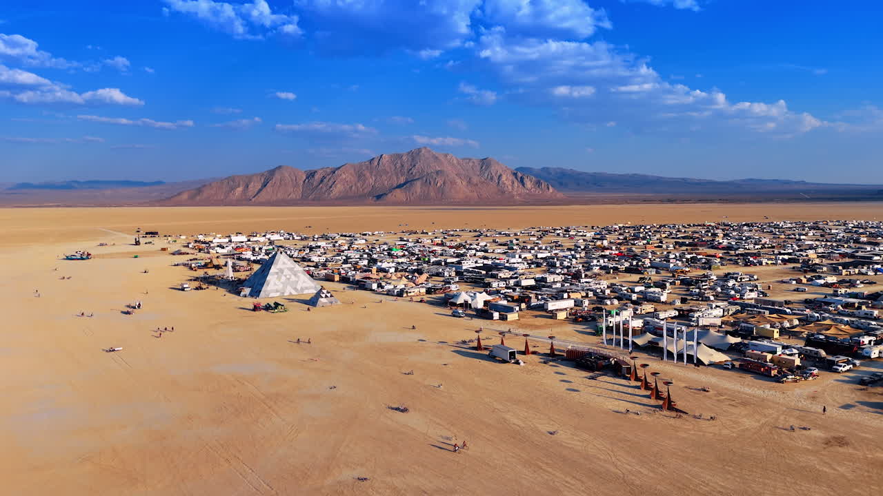 Nevada, USA, 22 August 2025: Burning Man desert camp panoramic aerial view. Aerial panorama of the Burning Man desert city camp with pyramid and tents