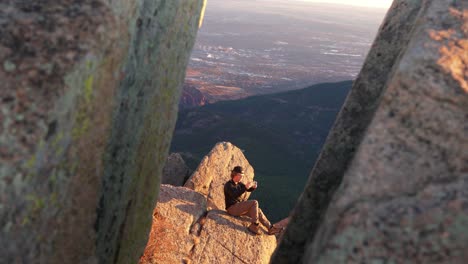 Tilt-up-on-golden-sunny-St-Peters-Dome-as-hiker-takes-cell-phone-photo