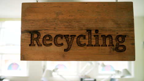 recycling sign on wooden plaque