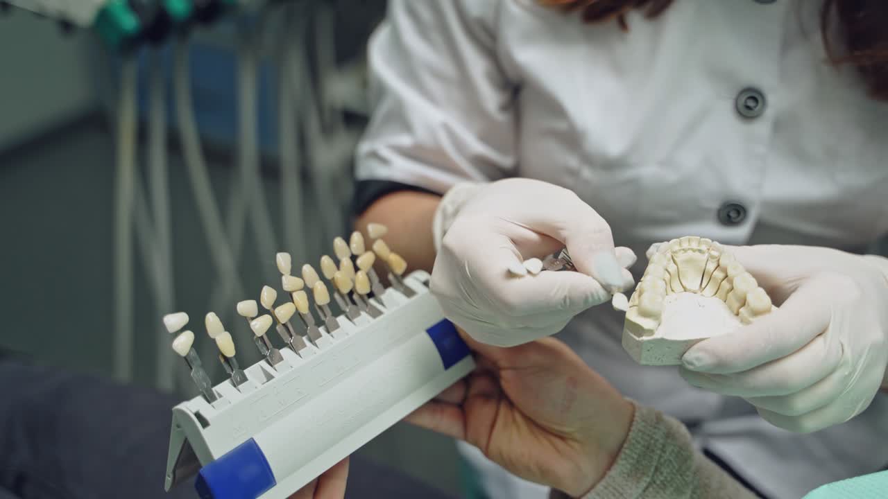 Dentist and patient in dentist office. Dental clinic.