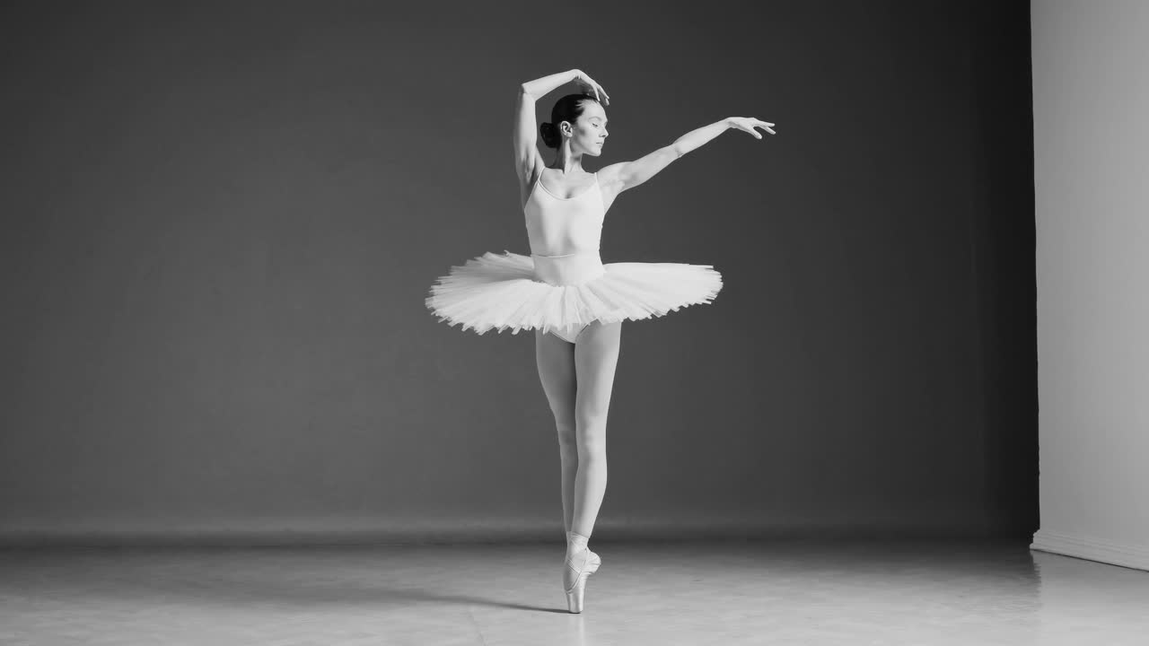 Elegant ballet dancer in mid-leap, captured in a side profile
