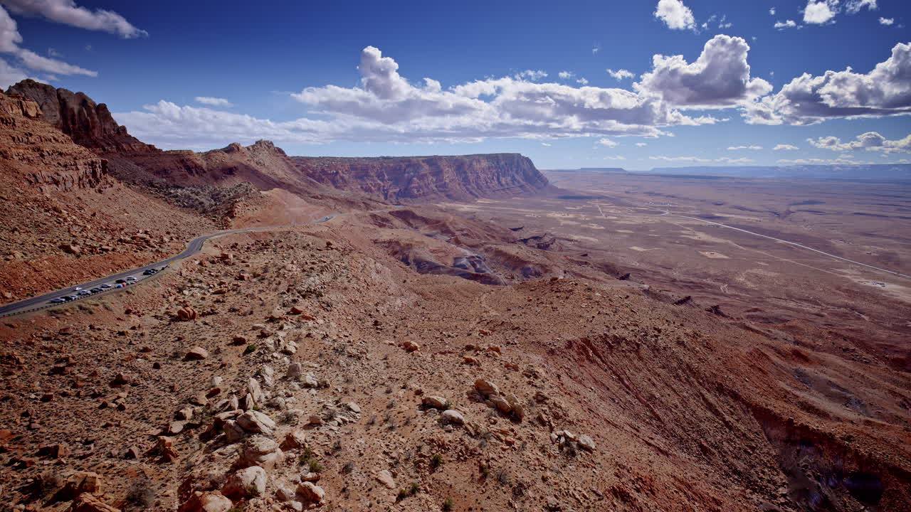 From above, a twisted path cuts through the fiery red mountains near Page, Arizona.