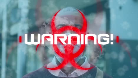 Animation-of-warning-text-and-virus-cells-over-man-wearing-face-mask