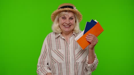happy senior woman holding passports excited for vacation