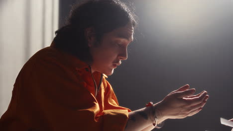 inmate examining evidence photo and denying his guilt during interrogation