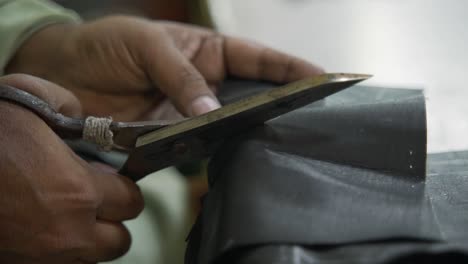 closeup of leather cut for designer fashion clothing, manufacturing industry in pakistan