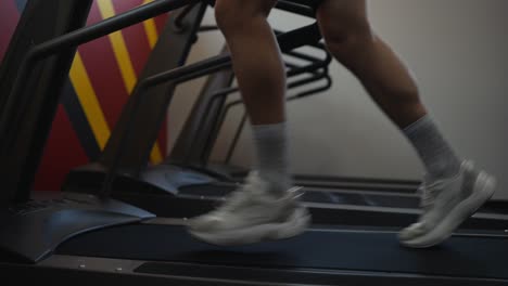 a man running on a treadmill at the gym