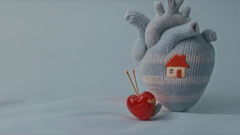 knitted heart with a house and a small heart