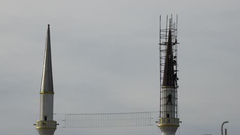 repair of the minaret of the mosque. before the month of ramadan, masters work on the minaret of the mosque.