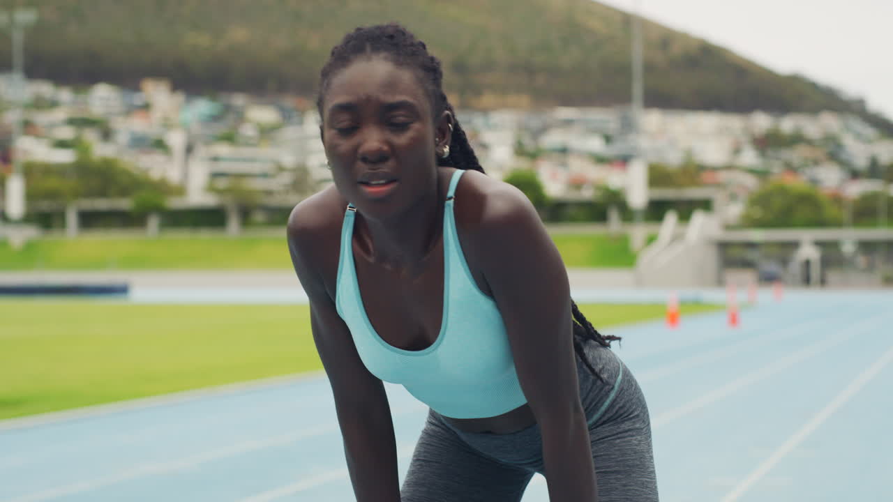 Tired athlete checking smartwatch