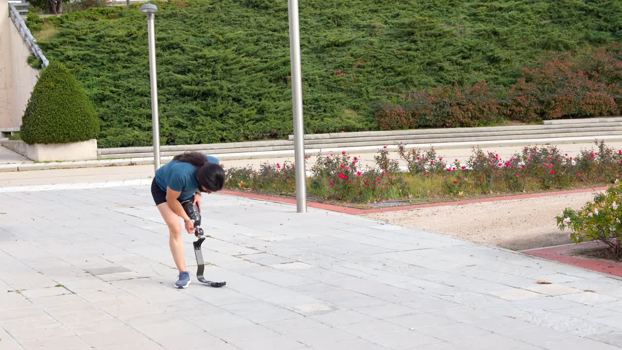 Man with prosthetic leg exercising outdoors