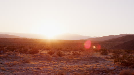 desert landscape at sunset seen from moving vehicle