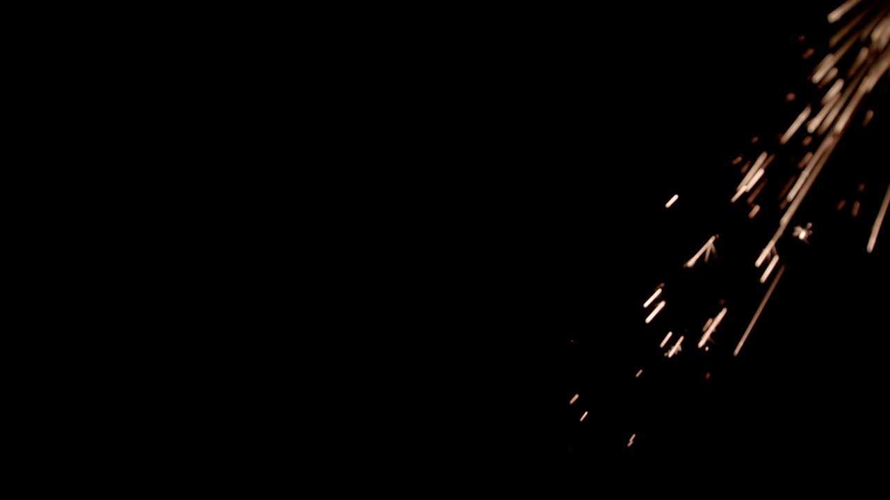 chispas amarillas brillantes sobre un fondo negro