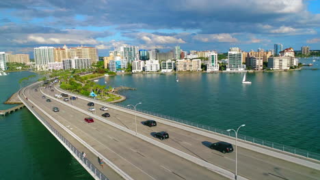 aerial flight over traffic on john ringling bridge going into downtown sarasota in florida