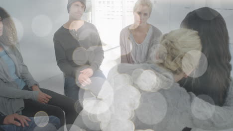animación de puntos de luz sobre diversas personas que participan en la terapia de grupo