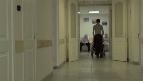 young guy moves along the corridor