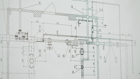 close-up of an engineer or architect working on a technical blueprint