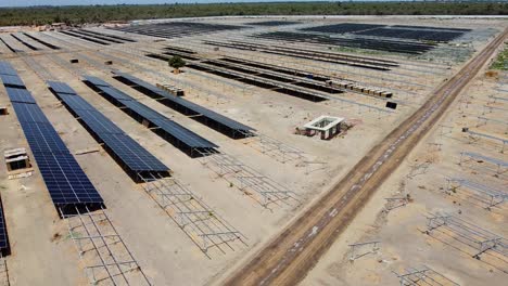flying over photovoltaic power plant with solar panels under construction in jambur, gambia