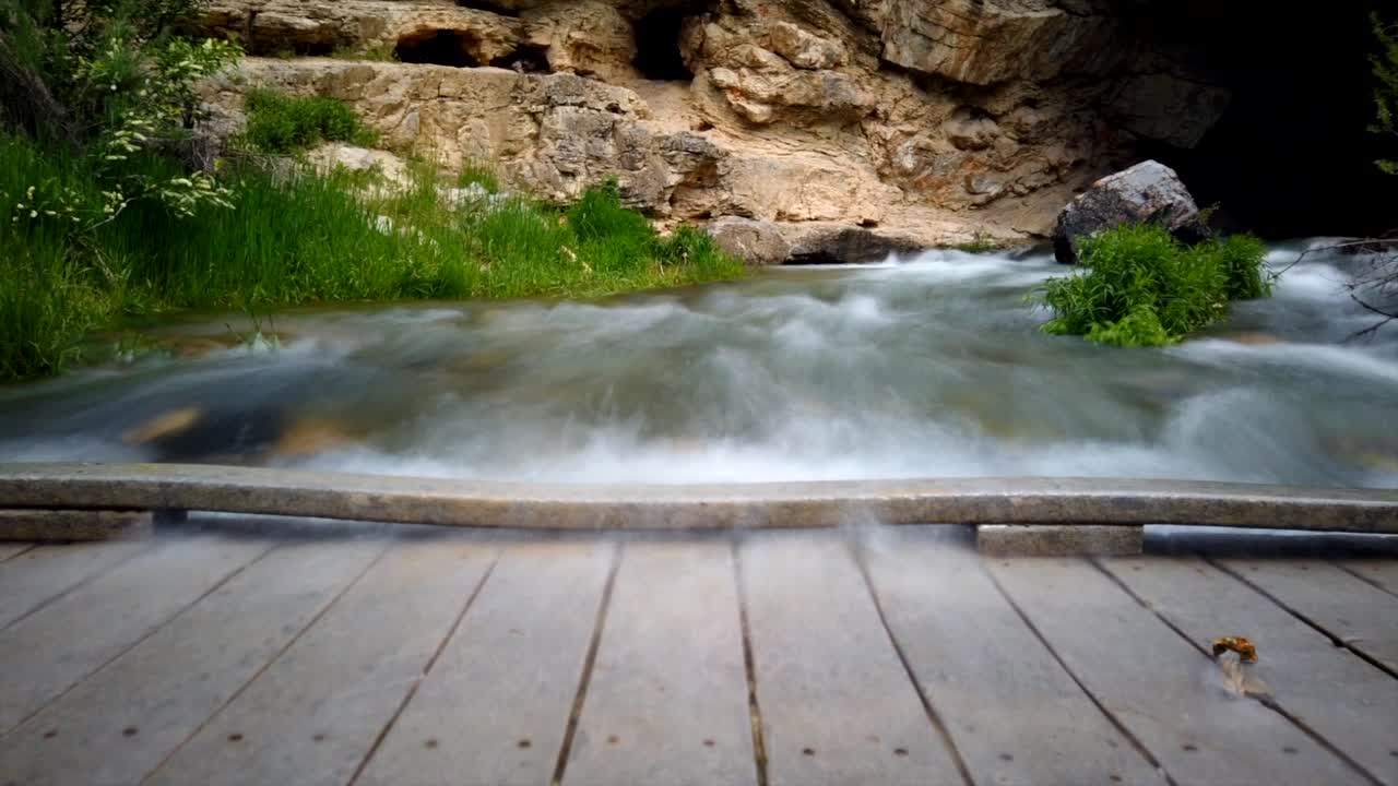 Serene River Flowing Through Rocky Landscape