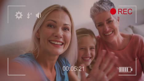 Animation-of-play-screen-over-caucasian-family-taking-selfie