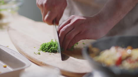 chef chopping parsley