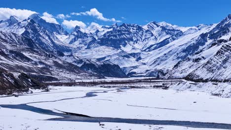 frozen river valley in the himalayas